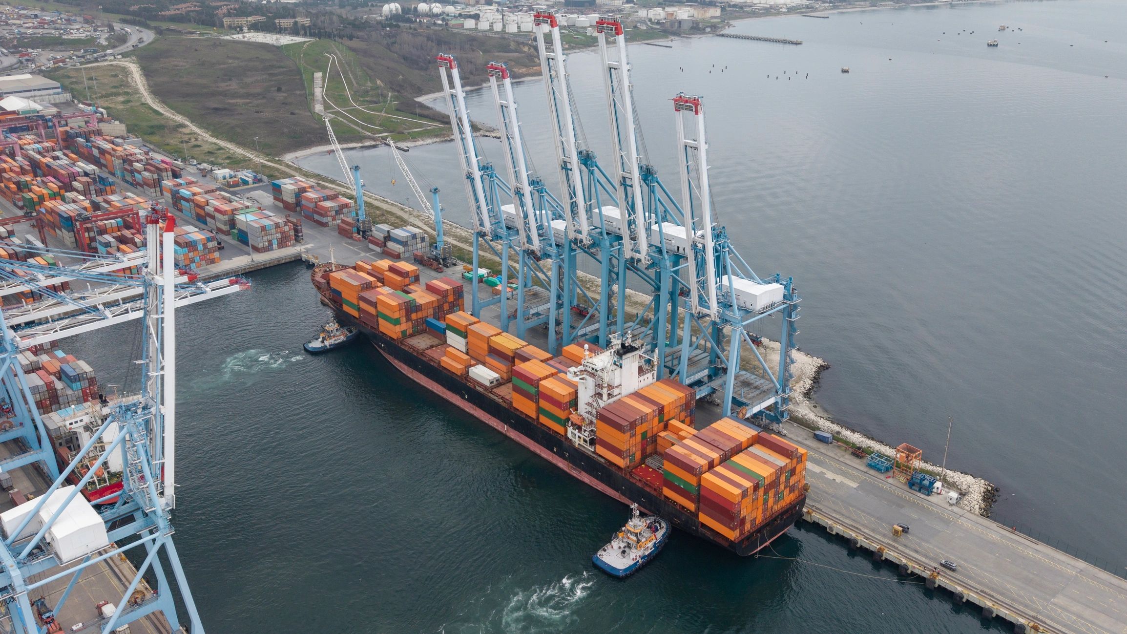 Container ship docking at an industrial port